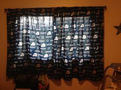 the curtains are decorated with skulls and bones