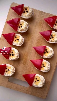 small devil's head appetizers are arranged on a cutting board