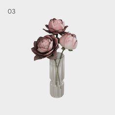 three pink flowers in a glass vase on a white background with the number 30 written below it