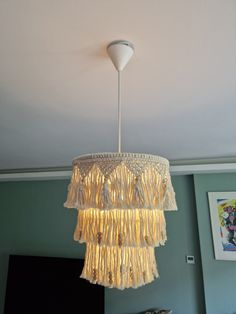 a chandelier hanging from the ceiling in a bedroom