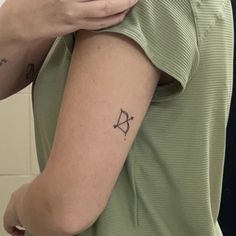 a person with a small tattoo on their arm