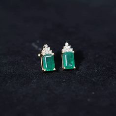 Product Details Complement your party outfit with these stunning Stud Earrings adorned with Octagon Cut Emerald Solitaire and Round Shape Diamond Accent. Solid Gold build gives a charming appeal to these Stud Earrings. Product Information SKU SHP-EARRINGS0821395357 Length 9.5 mm Width 4.3 mm Weight 1.22 gm (Approximate) EMERALD INFORMATION No.of Stones 2 Pieces Total Weight 1.32 Carat (Approximate) Dimension(approx) Emerald Cut-4X6 mm-2 Pcs Color Green Cut Brilliant Shape Emerald Cut Setting Typ Emerald Stud Earrings, Emerald Diamond Earrings, Emerald Earrings Studs, Diamond Earring, Ruby Earrings, Signature Jewelry, Ear Rings, Emerald Earrings, Women's Jewelry And Accessories