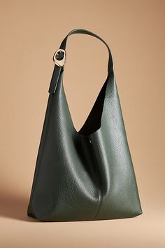 This oversized tote is your new BFF. Tied with two playful knots, this just-right sized, slouchy silhouette is designed to hold all your essentials (and more!) effortlessly – and with a touch of oh-so-fashionable flair. | The Love Knot Slouchy Bag: Buckle Edition by Anthropologie in Green, Women's, Polyurethane Winter Purses, Slouchy Tote, 2024 Wishlist, Slouchy Bag, Oversized Bag, Oversized Tote, Green Fits, Leather Bag Women, Love Knot