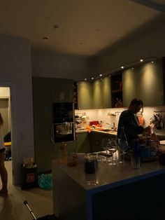 two women are in the kitchen preparing food