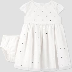 The season of gathering is here and so is the perfect dress for your little miss! Baby girl is sure to steal the show no matter the occasion in this white dress adorned with glitter dots. Pair this sweet dress with a cardigan to give her a classic look for the season. This 2-piece dress set includes a coordinating diaper cover so baby girl keeps her style while playing freely! This 2-piece dress set for baby girl is Standard 100 by OEKO-TEX, so it's certified clean for your little one. Dress With A Cardigan, Dotted Dress, Cord Dress, Floral Ruffle Dress, Ribbed Dresses, Diaper Cover, Sweet Dress, Dress Set, Navy Blue Dresses