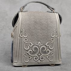 Introducing our Women's Leather Small Backpack, a stylish Boho pack with a unique embossed design that adds flair to your ensemble. This versatile backpack features one main section and a small pocket for your mobile phone, ensuring easy organization and quick access to your essentials. With a button to securely fix your keys, you'll never have to worry about misplacing them at crucial moments. The adjustable shoulder strap offers a length range of 47.2 to 31.5 inches (120 to 80 cm), providing c Bar Accessories Decor, Embossed Design, Easy Organization, Unique Bags, Small Backpack, Bar Accessories, Office Accessories, Handmade Accessories, Handmade Bags