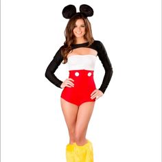 a woman in mickey mouse costume standing with her hands on her hips and legs crossed