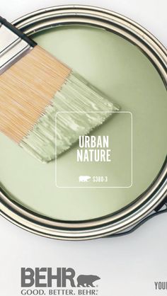 a paint can with a brush in it and the words urban nature painted on it