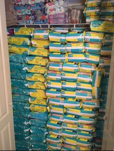 a closet filled with lots of diapers next to a wall full of other diapers