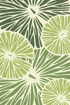 a green and white wallpaper with large leaf shapes on it's sides,