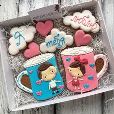 decorated cookies in a gift box for someone's special occasion, including coffee mugs