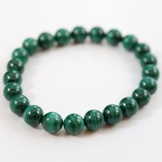 Handmade Malachite bracelet Stunning Malachite stretch bead bracelet. Malachite, known as the stone of transformation, is an incredible healing stone. It acts as the guardian of the heart and helps to instill positivity and optimism. It's a perfect stone for your heart and throat chakra. Materials: A grade Malachite gemstone beads Malachite Bracelet, Throat Chakra, The Guardian, Healing Stones, Chakra, Turquoise Bracelet, Gemstone Beads, Beaded Bracelets, The Incredibles