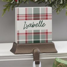 a christmas card holder with a name on it