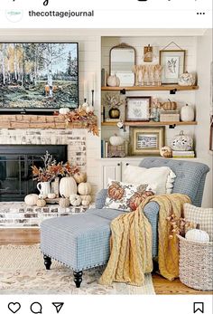 a living room filled with furniture and a fire place covered in fall decorating items