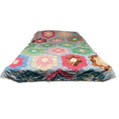 an image of a dog bed that is made out of fabric and has flowers on it