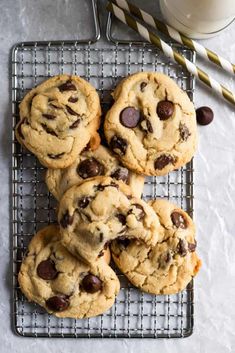 the best one bowl small batch chocolate chip cookies on a cooling rack next to a glass of milk