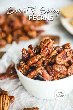 sweet and spicy pecans in a white bowl with text overlay that reads, sweet and spicy pecans