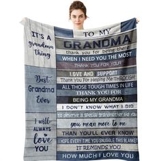 a woman holding up a blanket with the words to my grandma