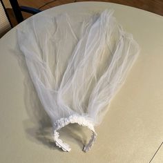 a piece of white plastic sitting on top of a table