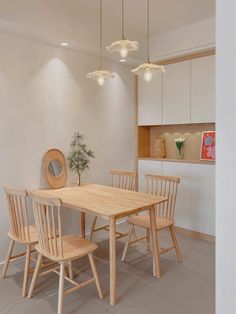 a wooden table and chairs in a room