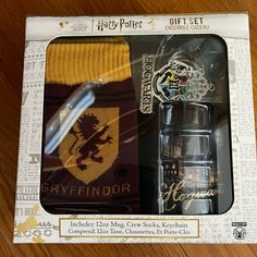 the harry potter gift set includes two socks, a hogwarts sweater and a watch