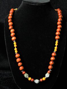 Introducing 'Ingrid', a wood bead necklace hand-made by music artist A Just Nova. Featuring large rich dark colored wood beads  accented with sherbet and clear glass beads. This necklace is a unique, one of a kind handmade creation. Ps. A Just Nova does not recreate any necklace pieces. You will be the only owner of this piece. Brown Wooden Beads Necklace For Meditation, Gift Amber Beaded Necklaces With Wooden Beads, Wooden Beaded Jewelry With Round Beads, Spiritual Wood Round Beads Jewelry, Handmade Wooden Jewelry For Meditation, Brown Wooden Beaded Jewelry, Artisan Brown Beaded Necklaces With 8mm Beads, Amber Necklace With Round Wooden Beads, Wooden Large Beads Jewelry As Gift