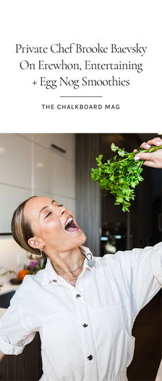 a woman is laughing while holding some greens