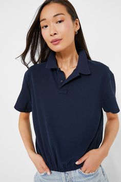 We can't stop talking about the Navy Collins Polo- and for good reason! This classic style staple includes a collar, partial front button placket, and and elastic waistband that gives you a clean, cinched in look without the fuss of tucking in your shirt. Pair with wide leg trousers and loafers for work, or with denim shorts and sneakers for weekend play.
Collar
Short sleeves
Front two button placket
Relaxed fit
Elastic waistband
Material: 65% Cotton, 35% Polyester
Care: Hand wash cold, hang to dry Cocktail Attire, The Navy, Stop Talking, Night Looks, Office Fashion, Pullover Sweatshirts, Wide Leg Trousers, Button Placket, Navy And White