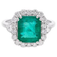 Item Code :- SER-22783 Gross Wt. :- 4.82 gm 18k White Gold Wt. :- 3.95 gm Natural Diamond Wt. :- 0.81 Ct. ( AVERAGE DIAMOND CLARITY SI1-SI2 & COLOR H-I ) Emerald Wt. :- 3.52 Ct. Ring Size :- 7 US & All ring size available ✦ Sizing ..................... We can adjust most items to fit your sizing preferences. Most items can be made to any size and length. Please leave a note at checkout or contact us via 1stDibs conversation. Even after purchasing the item, you can still ask us to adjust the size or length. We will try our best to fix it if it is possible. ✦ Import Duties, Taxes and Custom Charge ..................... Import duties, taxes and customs charges are not included in the items price or shipping cost. These charges are the buyer's responsibility. Please check with your country's c Cocktail Ring Diamond, Emerald Cocktail Ring, Emerald Cocktail, Jewels Rings, Zambian Emerald, Diamond Cocktail Rings, White Gold Jewelry, Modern Ring, Emerald Stone