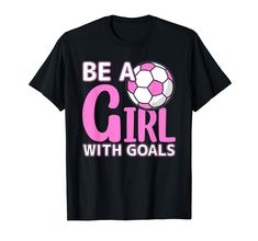 a black shirt with pink lettering that says be a girl with goals on the front