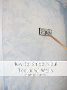 a paint roller is being used to paint a wall