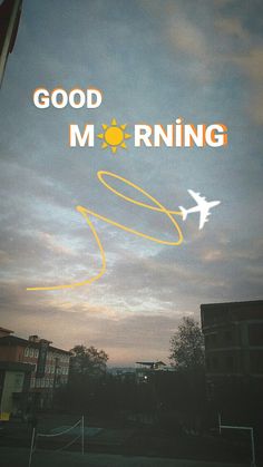 an airplane is flying in the sky with good morning written on it