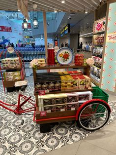 an old fashioned tricycle is on display in a store