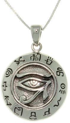 an eye is shown in the center of this pendant