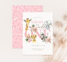 a pink and white baby shower with giraffes, elephants, and flowers