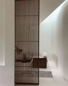 a room divider made out of wooden slats