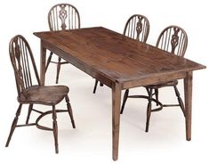 an old wooden table with four chairs around it and one chair on the other side