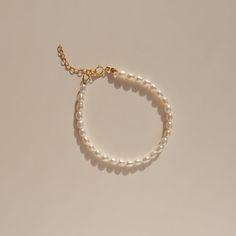 A classic pearl piece that will never go out of style. Handmade with freshwater rice pearls and 14k gold filled findings. She's the matching bracelet for the Vivian Pearl Choker. Wear it with Alida Pearl Ring, they are the perfect match! Details 3.5mm freshwater rice pearls.  14k gold filled. Extender chain of 3.5cm is available as an add-on. Wanna browse more of my bracelet series? https://www.etsy.com/ca/shop/PrettyPearlfect?section_id=31793519 Take a look at my shop to discover more pieces th Etsy Finds Products, Pearl Bracelet Gold, Rice Pearls, Pearl Bracelets, Freshwater Pearl Jewelry, Freshwater Pearl Ring, Etsy Bridesmaid Gifts, Matching Bracelet, White Jewelry