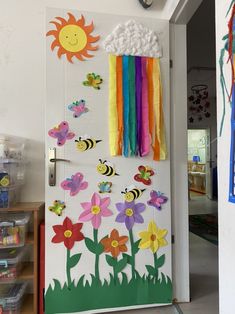 a door decorated with paper flowers and bees