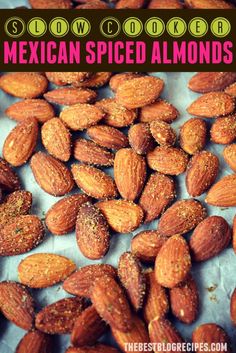 raw mexican spiced almonds with text overlay that reads slow cooker mexican spiced almonds