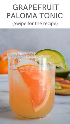 the grapefruit paloma tonic is garnished with an orange slice