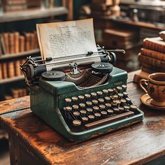 an old fashioned typewriter sitting on top of a wooden table next to some books