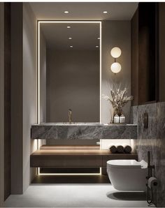 a bathroom with a sink, toilet and mirror in it's center wall area