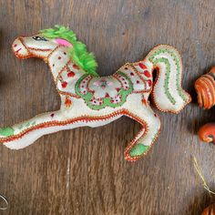 a small toy horse sitting on top of a wooden table