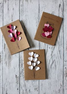 three valentine's day cards with hearts in a mason jar and flowers on them