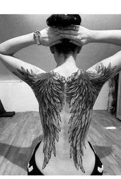 a woman with wings on her back