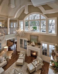 a living room filled with furniture and a fire place in the middle of a room