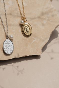 This non-tarnish sterling silver necklace is an updated look on a classic way to wear your faith. The Miraculous Medal Necklace is a beautiful visual reminder of our eternal mother. This elegant piece serves as a reminder in the power of faith filled prayer. Whether you are dressing up or dressing down this meaningful necklace is the perfect focal point of any outfit. Stats: Hypoallergenic Non- tarnish Waterproof Elegant Sterling Silver Necklace With Miraculous Medal, Spiritual Sterling Silver Necklace With Miraculous Medal, Elegant Miraculous Medal Necklace, Elegant Miraculous Medal Jewelry For Gift, Elegant Miraculous Medal Jewelry Gift, Spiritual Silver Necklace With Pearl Charm, Elegant Miraculous Medal Necklaces As Gift, Elegant Miraculous Medal Pendant Necklace, Elegant Miraculous Medal Necklace For Gift