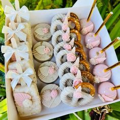 a box filled with lots of different types of cookies and pretzels next to each other