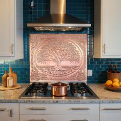 a stove top oven sitting inside of a kitchen next to a counter with oranges on it